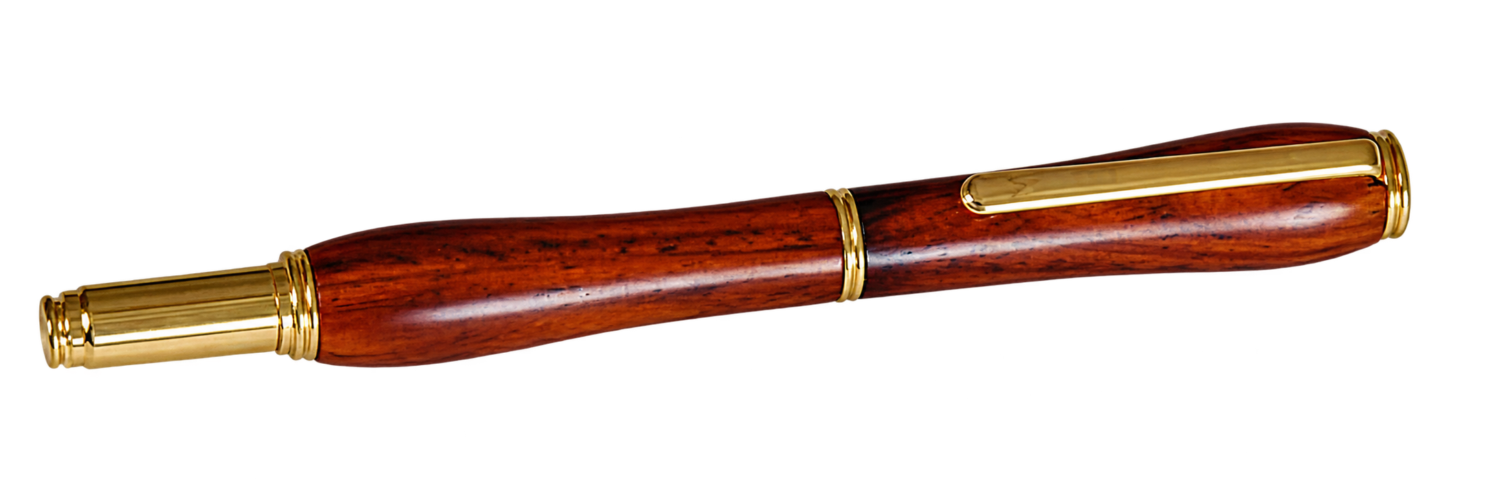 The Artisan pen in cocobolo, a dark red-brown striped wood, finished in 22K gold, capped and lying at an angle.