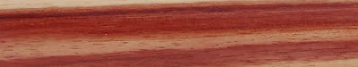 A turned strip of tulipwood: pale cream and rose, boldly striped with darker red.